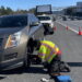 조지아 고속도로 로드 서비스 '챔프' 기사가 박씨 차량의 펑크난 타이어를 교체해주고 있다. [독자 박모씨 제공]