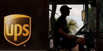 FILE PHOTO: A UPS delivery van is driven long a city street in Garden Grove, California, U.S., March 29, 2022.   REUTERS/Mike Blake/File Photo