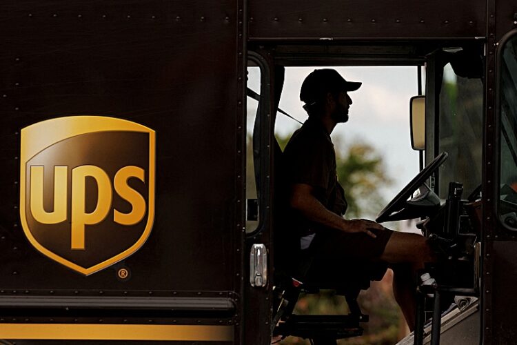 FILE PHOTO: A UPS delivery van is driven long a city street in Garden Grove, California, U.S., March 29, 2022.   REUTERS/Mike Blake/File Photo