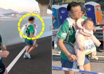 지난 21일 홍콩에서 열린 마라톤 대회에서 한 남성 참가자가 아기를 가슴에 안고 배낭을 멘 채 달리는 모습이 포착됐다. 사진 유튜브 캡처