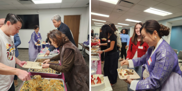 설맞이 행사 참석자들이 한식을 접시에 담고 있다.